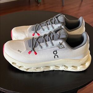 On Running Cream and Gray Athletic Shoes